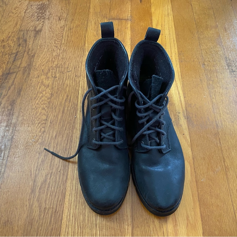 Cole Hann black leather lace up boots.
